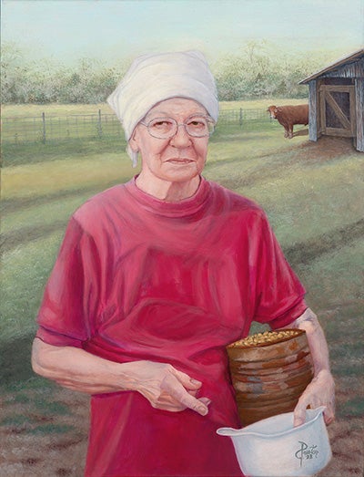 n the background on the left side of the painting, in front of the fence, a rust colored bull peaks out from behind a grayish barn and looks forward toward the front part of the painting, where one can see the torso of an older woman wearing a whitish bandana, red t-shrt and holding a rusty tin can full of feed grain and a small, whitish plastic bucket in her left hand. The image of her figure dominates the central part of the image. The woman has a bit of a bemused smile on her face.