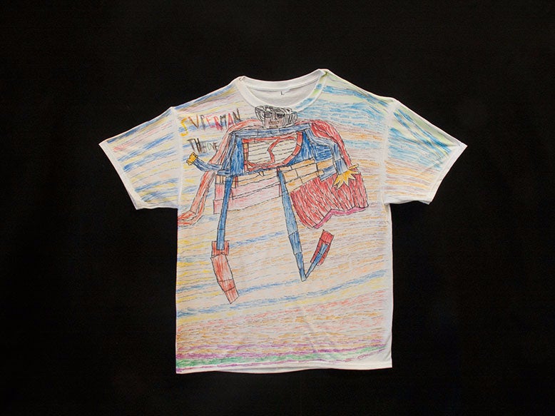 A short sleeve t-shirt with Pablo’s art design of Superman on it