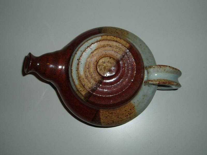 A multi-colored round shaped teapot