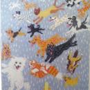 A depiction of "It's raining cats and dogs" on a piece of fabric.