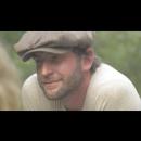 Image of a man with a hat in a film 