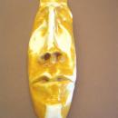  A face mask, glazed in yellow and white.