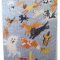 A depiction of "It's raining cats and dogs" on a piece of fabric.